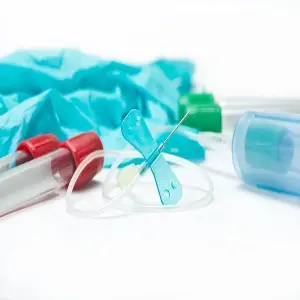 A close up of some toothbrushes and toothpaste